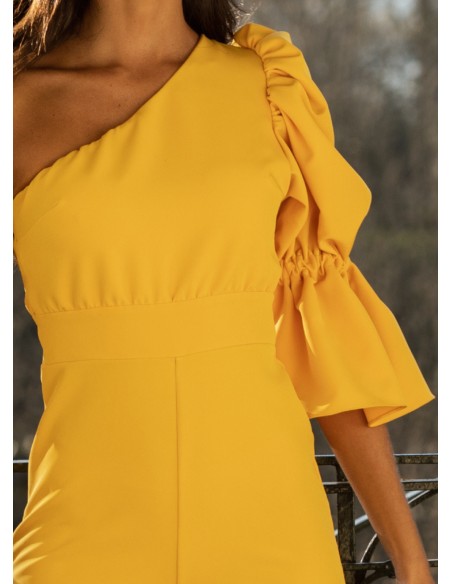 Yellow long jumpsuit with asymmetrical neckline and puffed sleeves