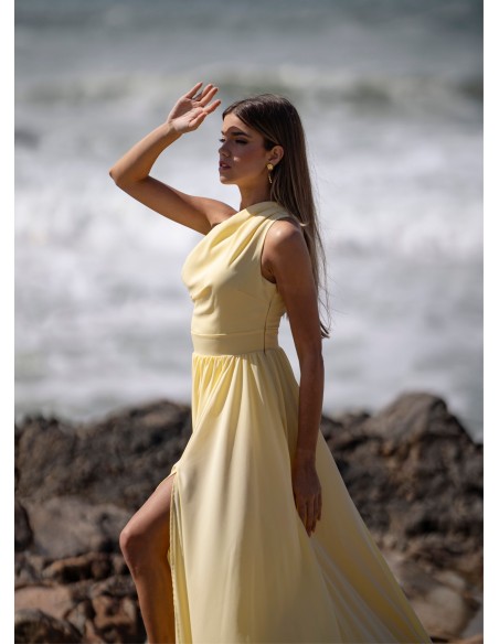 Light yellow long dress with asymmetrical neckline and front opening