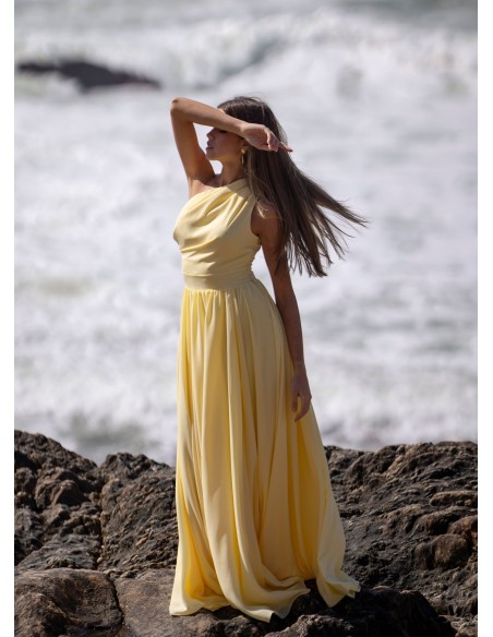 Light yellow long dress with asymmetrical neckline and front opening