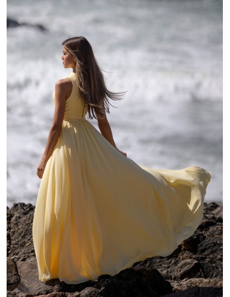 Light yellow long dress with asymmetrical neckline and front opening