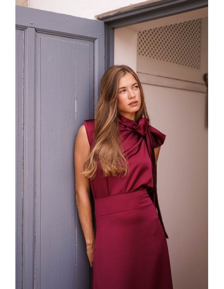 Asymmetrical burgundy top with lacing on one side