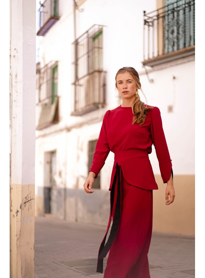 Dark red top with black cuffs and button