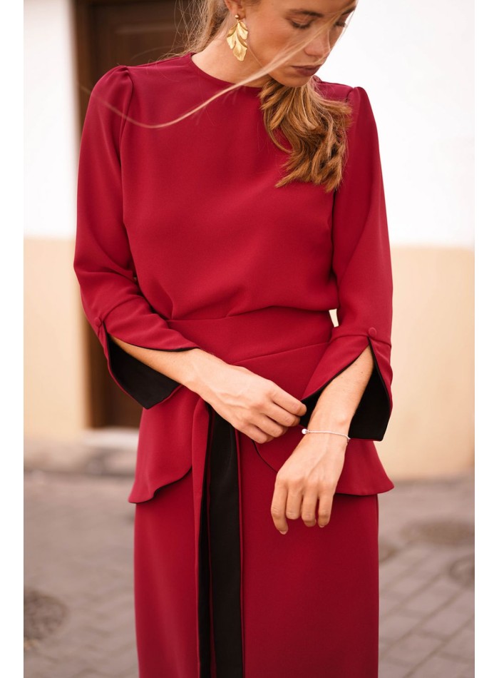 Dark red top with black cuffs and button