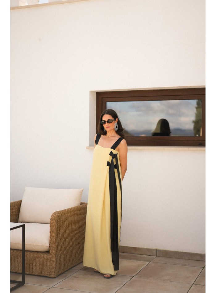 Long yellow dress with black bows