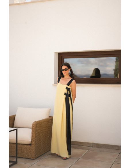 Long yellow dress with black bows