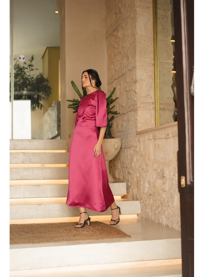 Blusa de fiesta fucsia con manga corta abullonada
