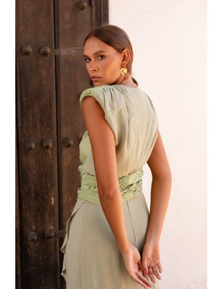 Green linen guest ensemble with wrap skirt