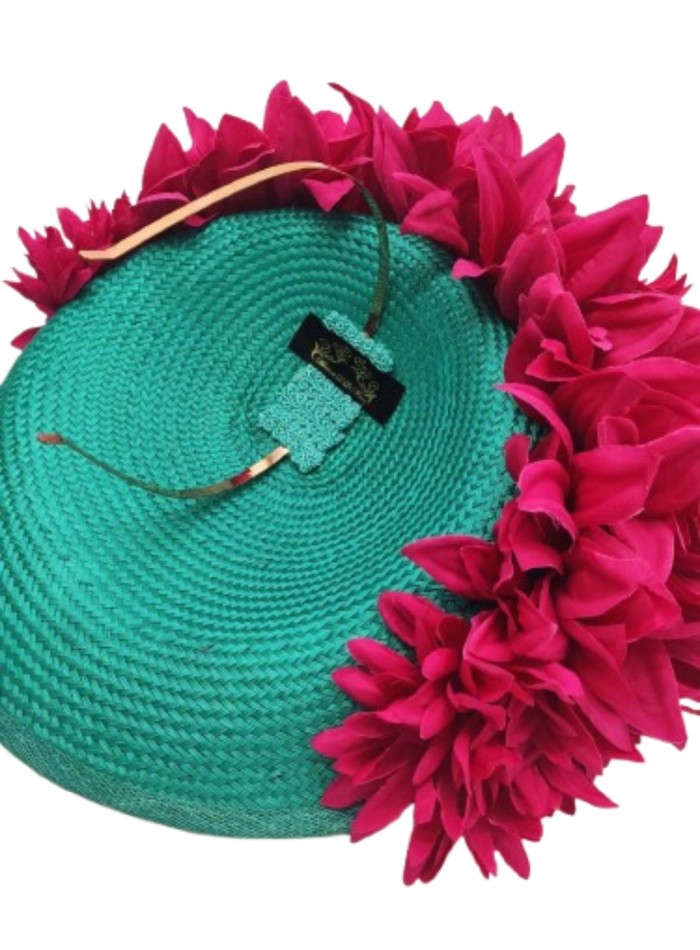 Turquoise guest headdress with fuchsia petals