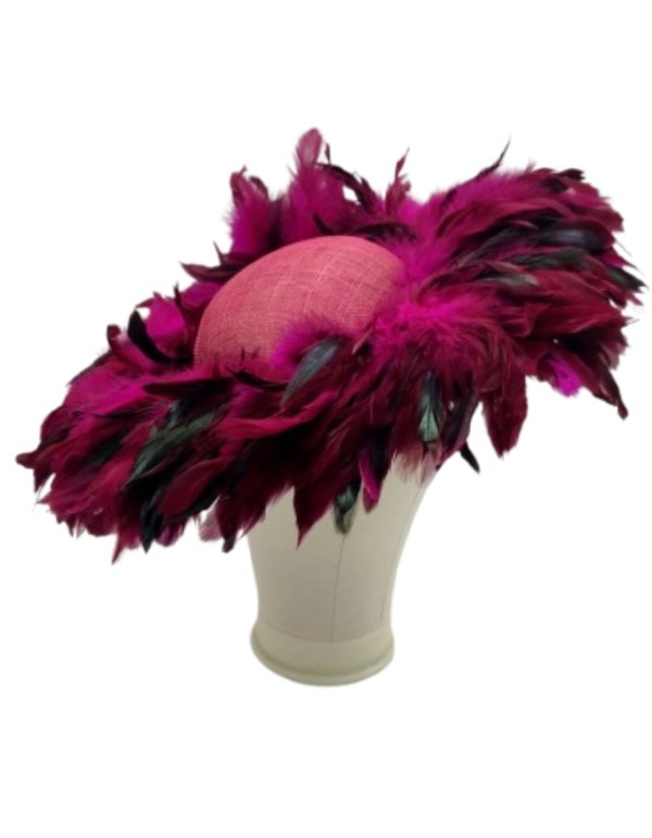 Pamela covered with pheasant feathers in bougainvillea color