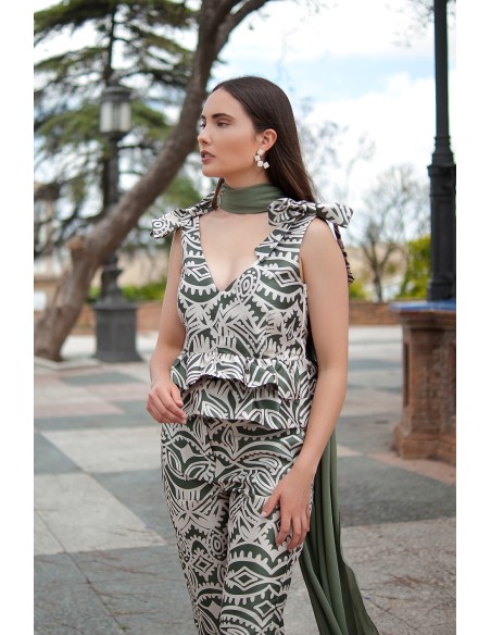 Top d'invité avec nœuds et volants à l'épaule