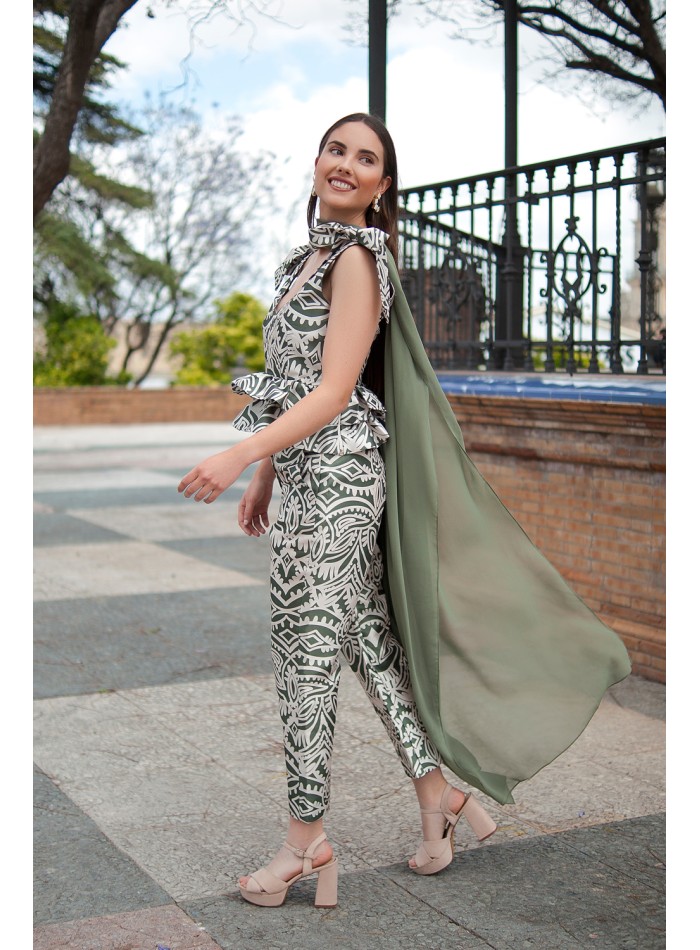 Top d'invité avec nœuds et volants à l'épaule