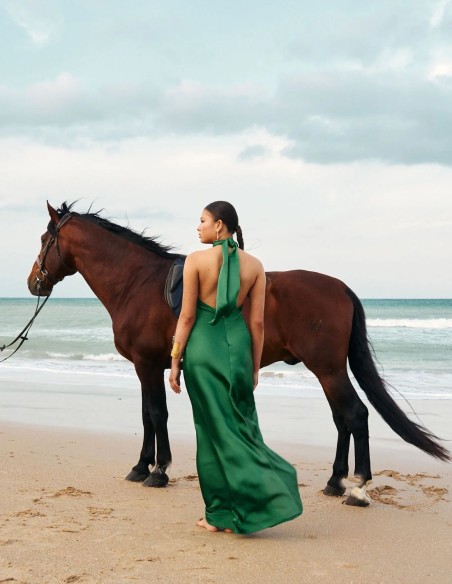 Long satin party dress with halter neckline and open back