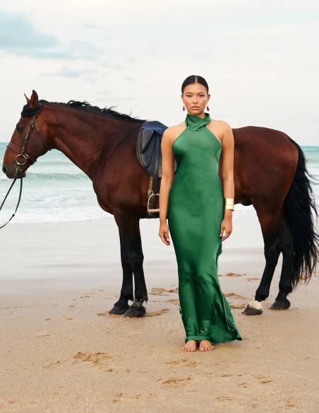 Long satin party dress with halter neckline and open back