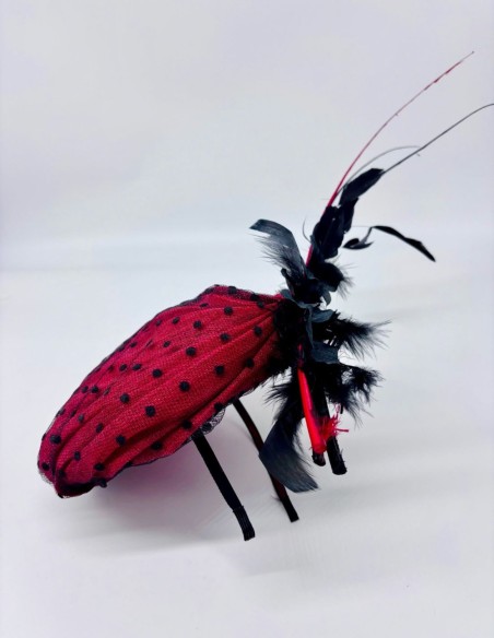 Sinamay base headdress pleated with plumeti tulle