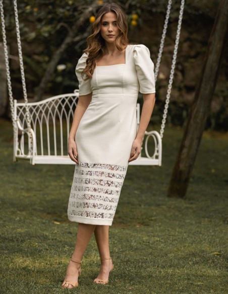 White midi dress with ruffled sleeves and bow detail