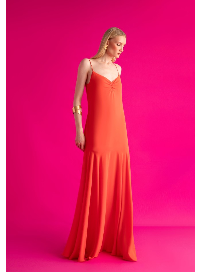 Long orange dress with ruffled neckline and...