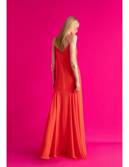 Long orange dress with ruffled neckline and cape skirt