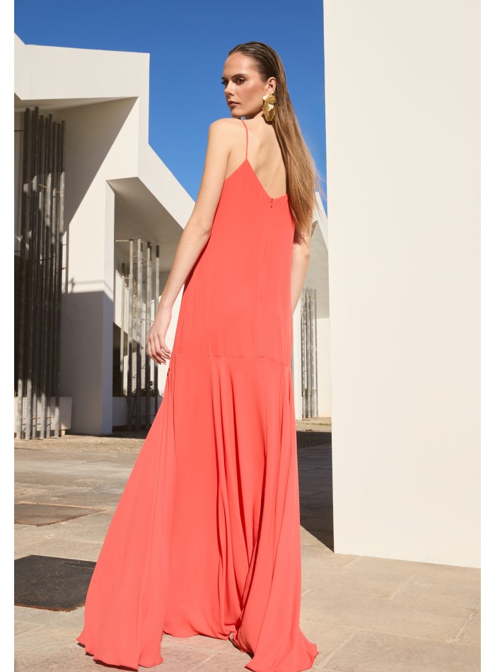 Long orange dress with ruffled neckline and...