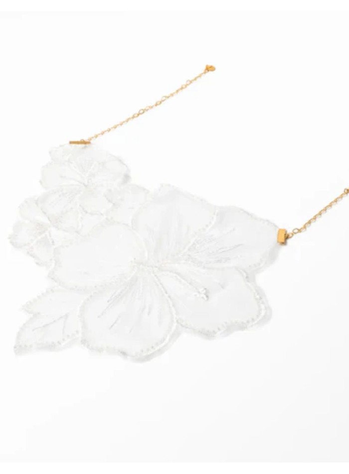 Necklace with white embroidered flowers