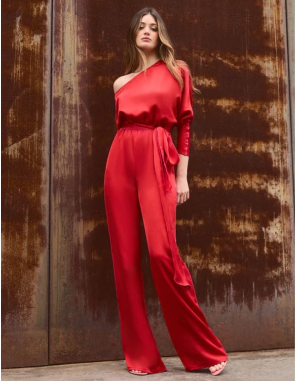 Asymmetric red jumpsuit with bat sleeves and belt