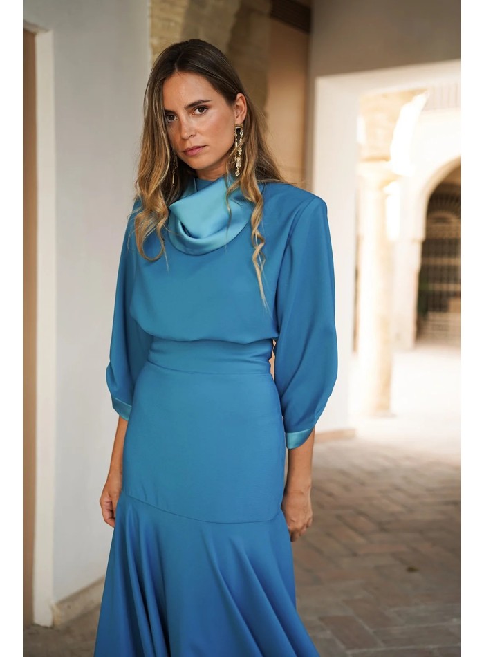 Elegant turquoise top with satin collar and cuffs
