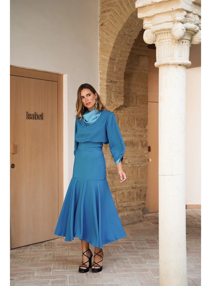 Elegant turquoise top with satin collar and cuffs