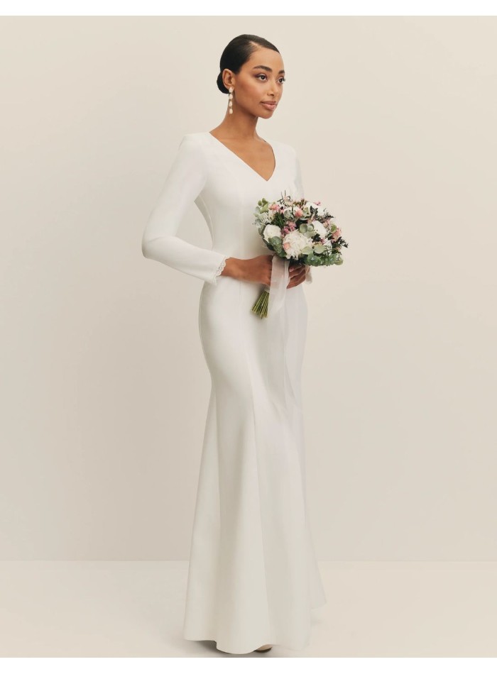 Long wedding dress with V-neckline and shoulder...