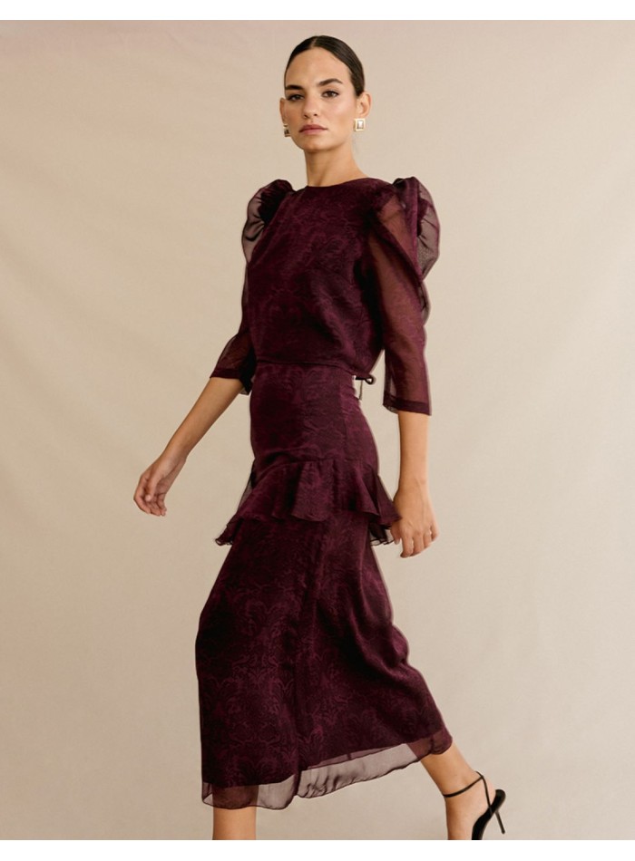 Ensemble blouse semi-transparente et jupe midi...