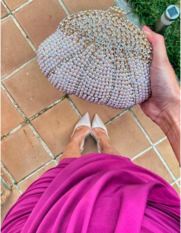 Shell-shaped party clutch with Swarovski crystals.