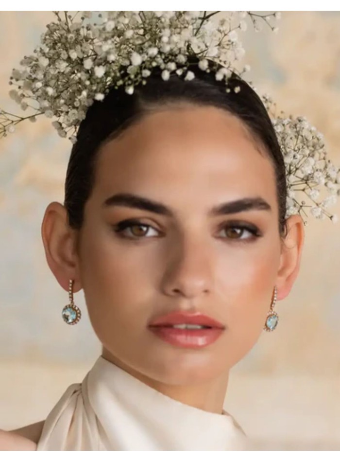 Earrings with aquamarine stone surrounded by...