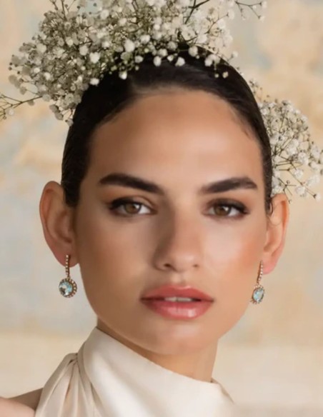 Earrings with aquamarine stone surrounded by zircons