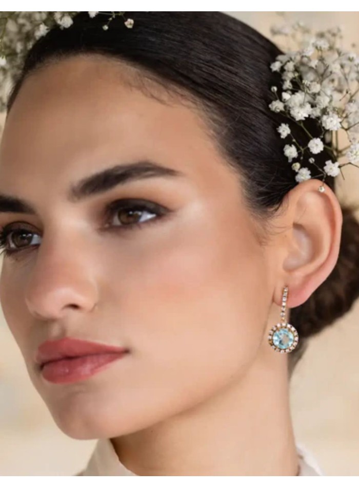 Earrings with aquamarine stone surrounded by...