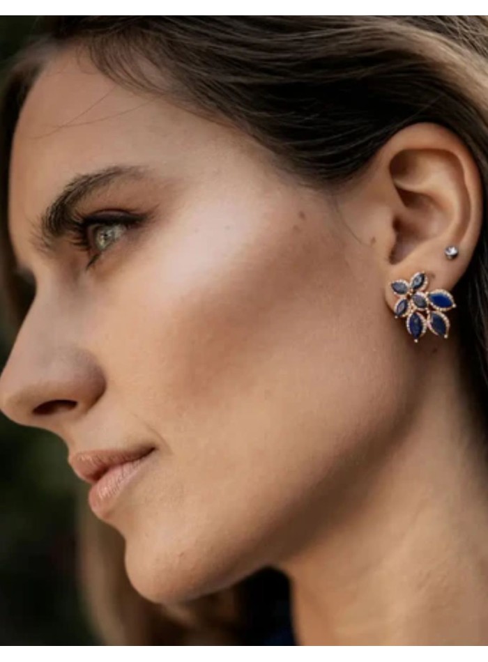 Earrings with flower design with blue stones...
