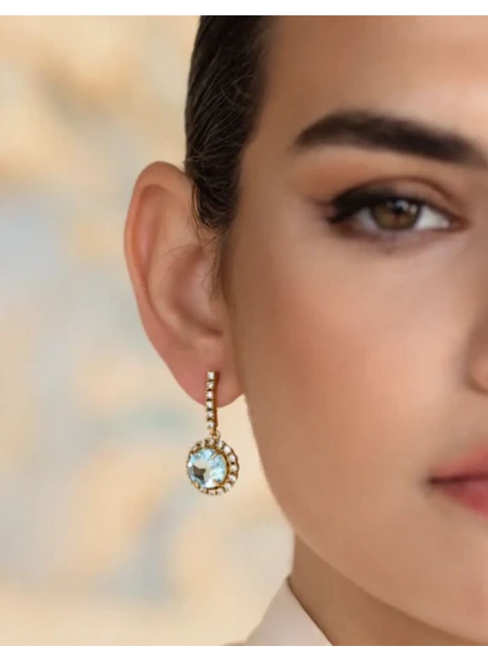 Earrings with faceted central stone surrounded...