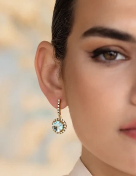 Earrings with faceted central stone surrounded by zircons