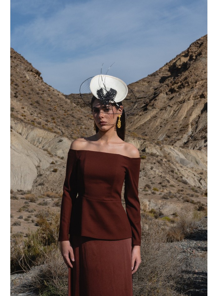 Guest outfit with peplum top and flared skirt