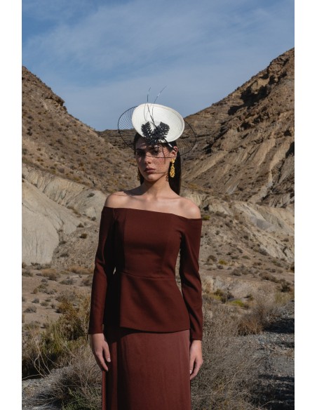 Guest outfit with peplum top and flared skirt