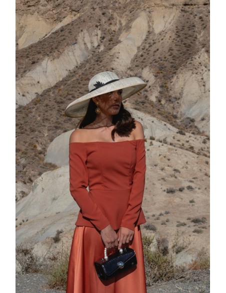 Guest outfit with peplum top and flared skirt