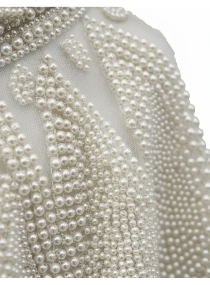 White jewel neckline with pearls and structured...