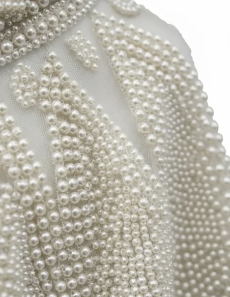 White jewel neckline with pearls and structured design