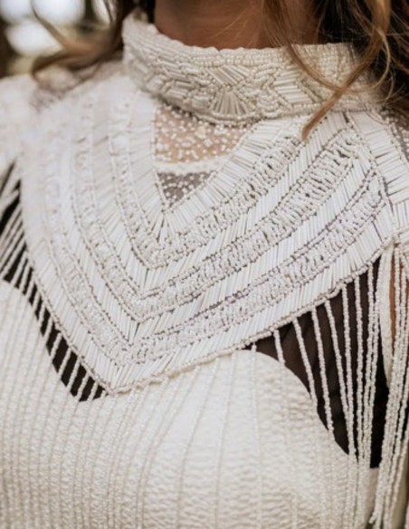 Bridal cape with beaded embroidery in delicate lines