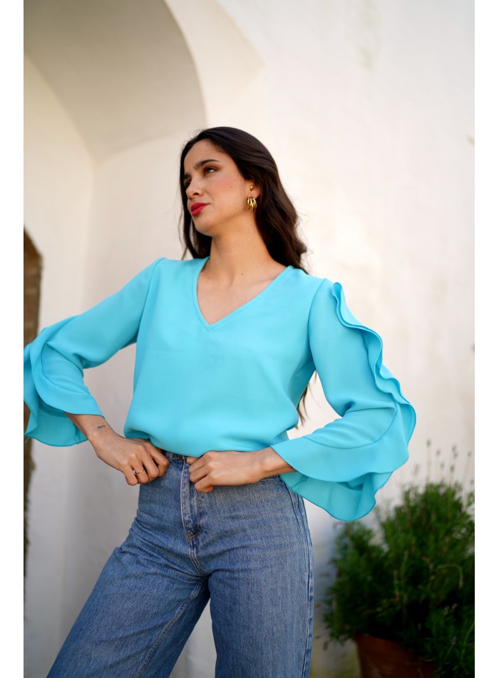 Aquamarine blouse with neckline slit and ruffle...
