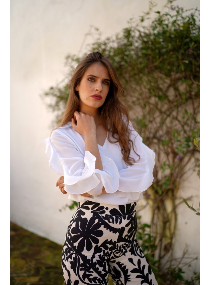 Blouse with neckline slit and ruffle sleeves