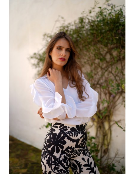 Blouse with neckline slit and ruffle sleeves