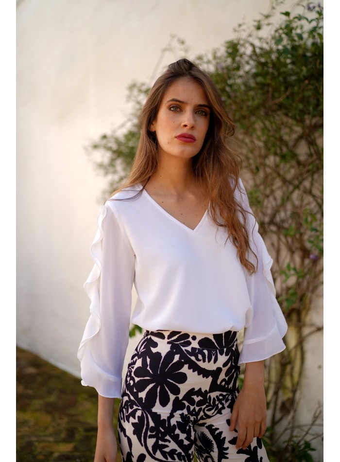 Blouse with neckline slit and ruffle sleeves