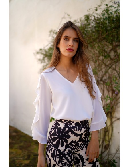 Blouse with neckline slit and ruffle sleeves