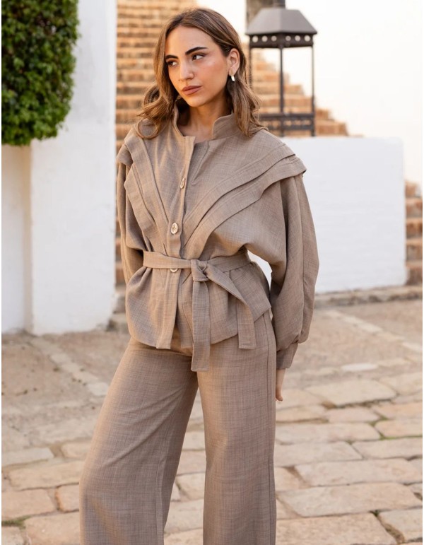 Beige jacket with bat sleeves