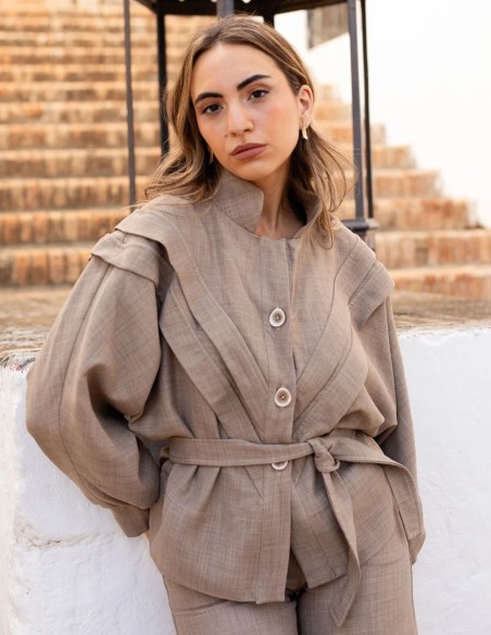 Beige jacket with bat sleeves