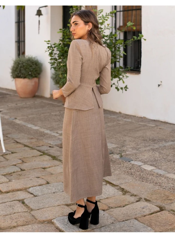 Beige long sleeve top with peplum waistband