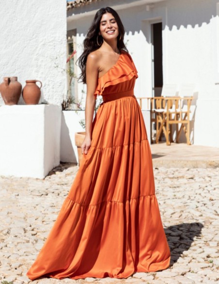 Long orange dress with ruffles and asymmetrical neckline